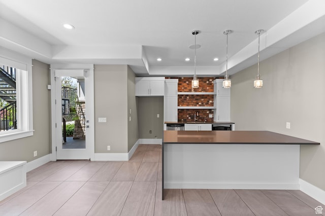 1769 View Ct, Fruit Heights, UT 84037 - kitchen featuring dark countertops, white cabinets, decorative light fixtures, a peninsula, and recessed lighting
