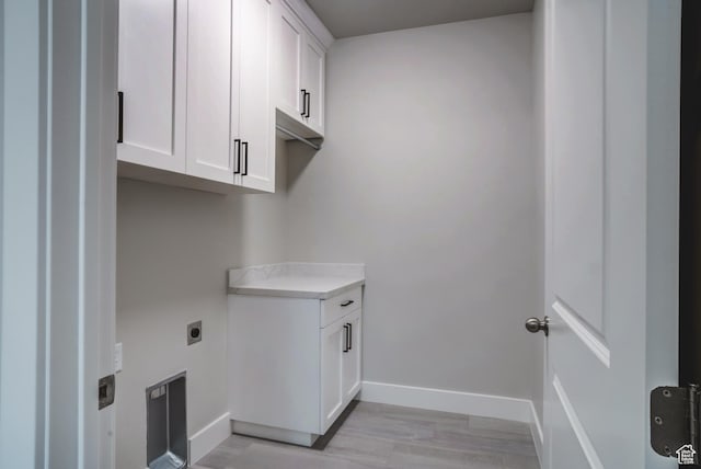 1269 W Hendrix St Unit 146, Riverton, UT 84065 - laundry room with hookup for an electric dryer, baseboards, light wood-style flooring, and cabinet space