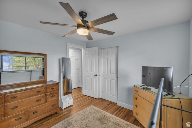 492 W Highland Dr, Riverdale, UT 84405 - bedroom featuring wood finished floors, baseboards, ceiling fan, and a closet