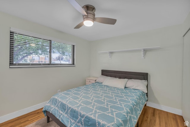 492 W Highland Dr, Riverdale, UT 84405 - bedroom with baseboards, wood finished floors, and ceiling fan