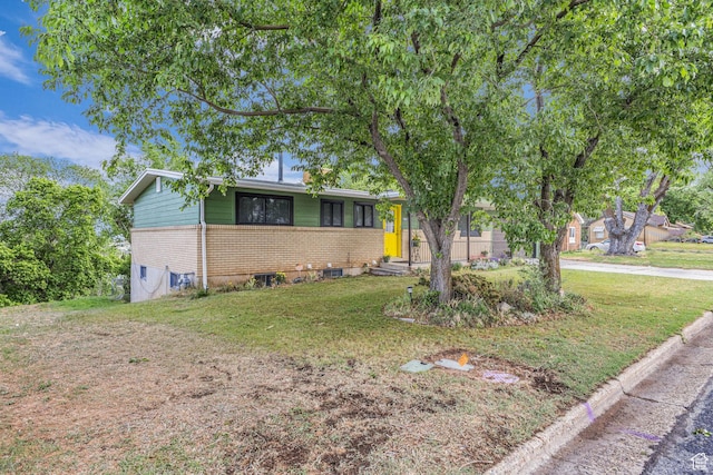 492 W Highland Dr, Riverdale, UT 84405 - view of front of house with brick siding and a front yard