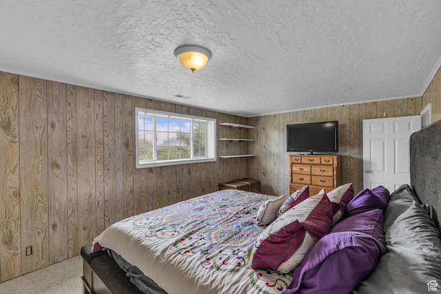 492 W Highland Dr, Riverdale, UT 84405 - carpeted bedroom with wood walls and a textured ceiling