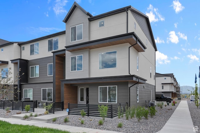 contemporary house with stucco siding