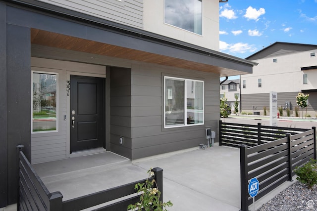 entrance to property featuring a porch