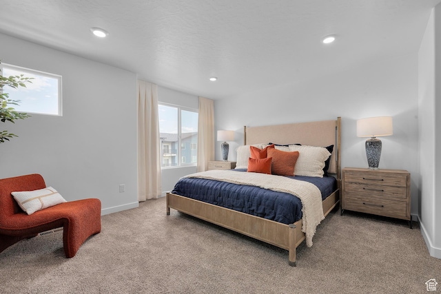 bedroom with carpet, multiple windows, recessed lighting, and baseboards
