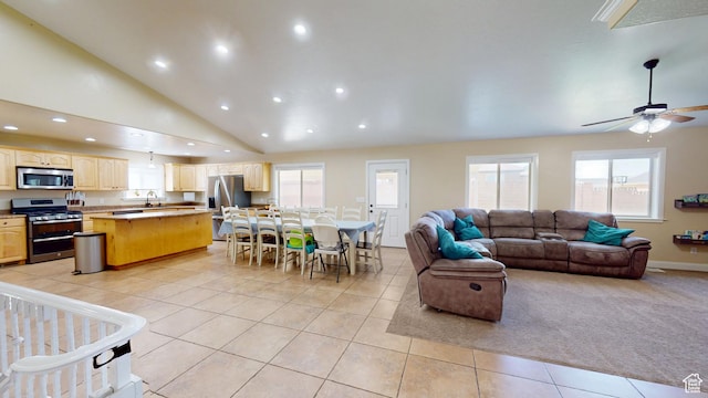 living room featuring light tile patterned floors, a ceiling fan, recessed lighting, and high vaulted ceiling