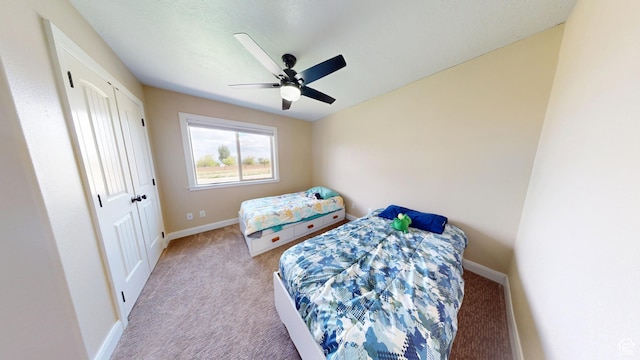 bedroom featuring carpet, baseboards, and ceiling fan