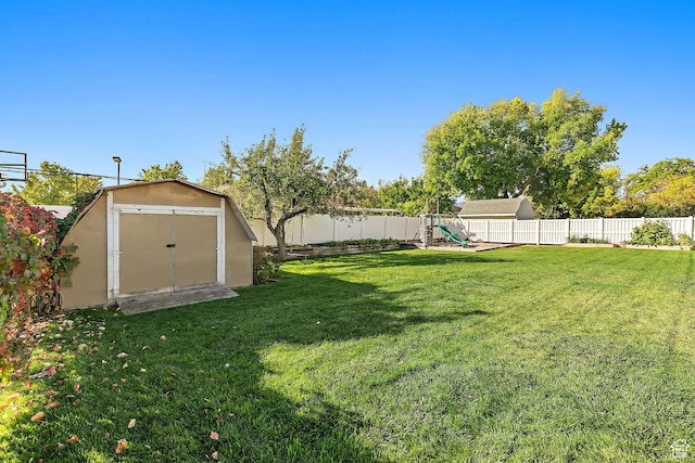 2119 W 12190 S, Riverton, UT 84065 - view of yard with a storage shed, a playground, and an outbuilding