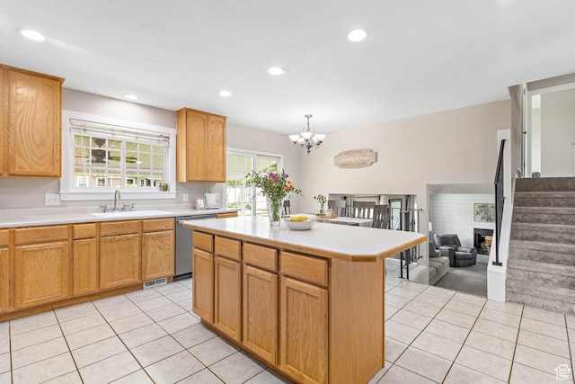 2119 W 12190 S, Riverton, UT 84065 - kitchen featuring dishwasher, light tile patterned flooring, a sink, light countertops, and a center island
