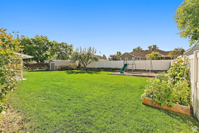 2119 W 12190 S, Riverton, UT 84065 - view of yard with a playground, a storage unit, and an outbuilding