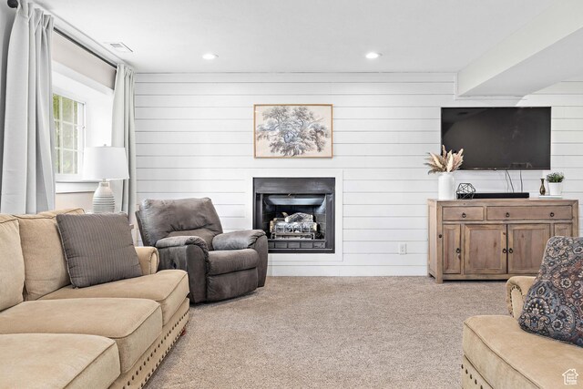 2119 W 12190 S, Riverton, UT 84065 - living area with light carpet, a fireplace, wooden walls, and recessed lighting