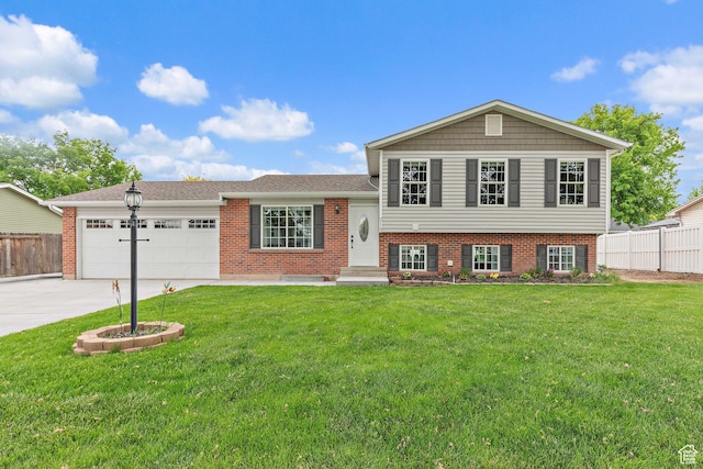 2119 W 12190 S, Riverton, UT 84065 - split level home featuring a garage, driveway, and brick siding