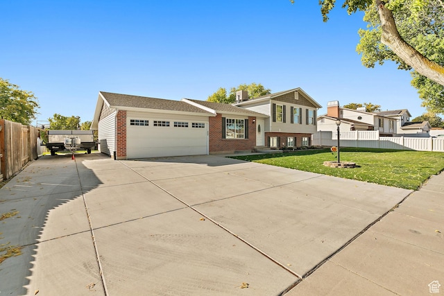 2119 W 12190 S, Riverton, UT 84065 - tri-level home featuring driveway, brick siding, and a garage