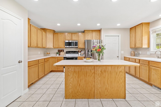 2119 W 12190 S, Riverton, UT 84065 - kitchen with stainless steel appliances, a sink, light tile patterned flooring, light countertops, and a center island