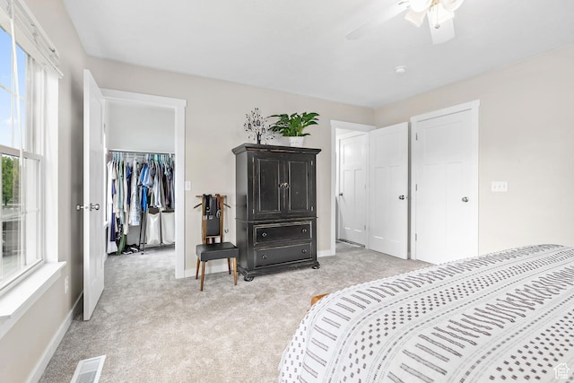 2119 W 12190 S, Riverton, UT 84065 - bedroom featuring light colored carpet, baseboards, a spacious closet, a closet, and ceiling fan