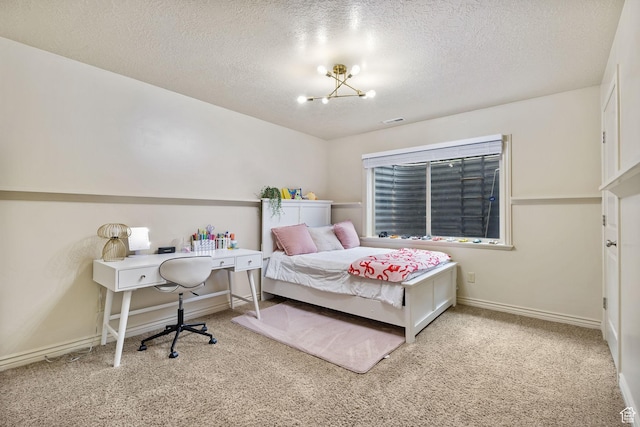 bedroom featuring carpet flooring, a chandelier, a textured ceiling, and baseboards