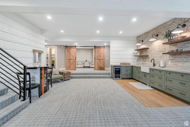 575 S 1560 E, Mapleton, UT 84664 - bar featuring beverage cooler, a sink, a barn door, stairway, and light wood-style floors