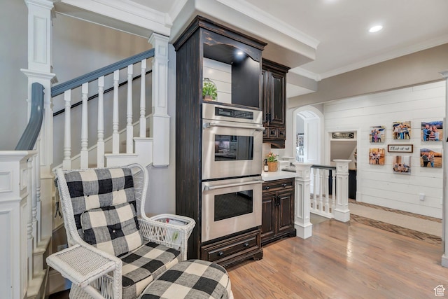 575 S 1560 E, Mapleton, UT 84664 - kitchen with stainless steel double oven, light wood-type flooring, dark brown cabinetry, ornamental molding, and recessed lighting