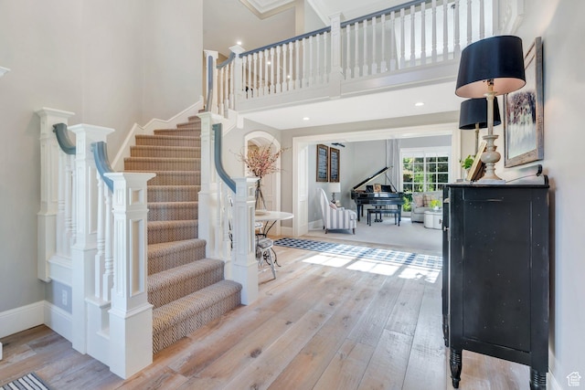 575 S 1560 E, Mapleton, UT 84664 - foyer with wood-type flooring, stairs, a towering ceiling, and baseboards