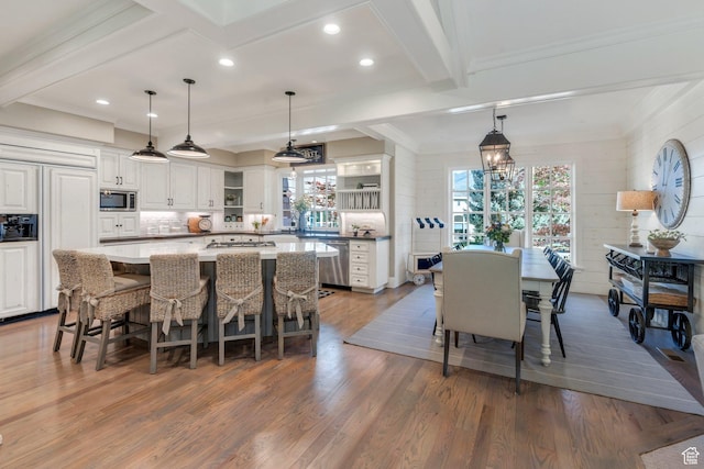 575 S 1560 E, Mapleton, UT 84664 - kitchen with open shelves, built in appliances, wood finished floors, white cabinets, and backsplash