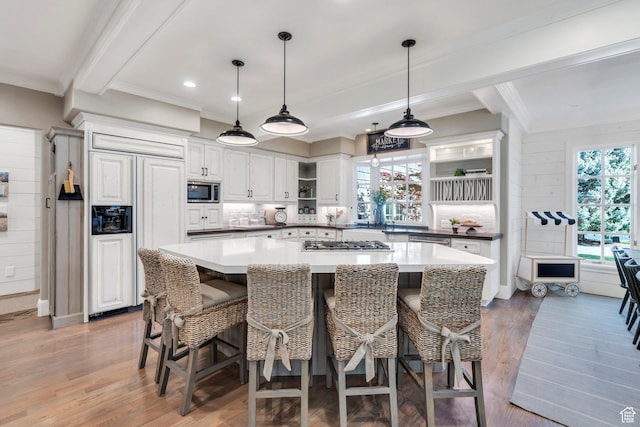 575 S 1560 E, Mapleton, UT 84664 - kitchen featuring built in appliances, ornamental molding, open shelves, wood finished floors, and white cabinetry