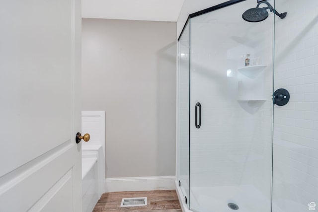 575 S 1560 E, Mapleton, UT 84664 - bathroom featuring a shower stall, wood finished floors, a bath, and baseboards