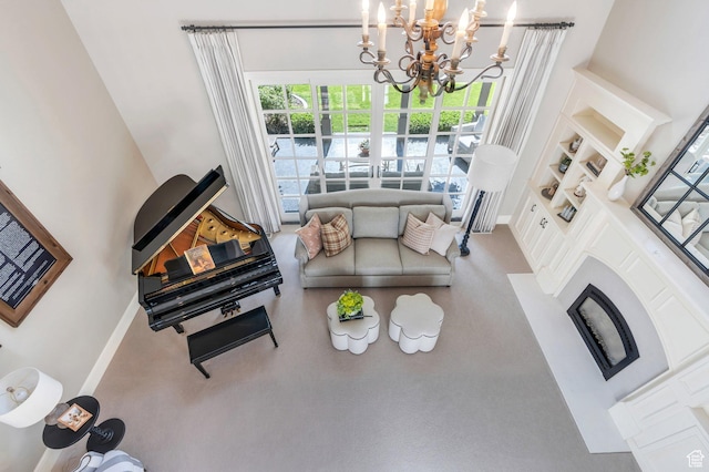 575 S 1560 E, Mapleton, UT 84664 - living room with a chandelier, built in features, baseboards, and a high ceiling