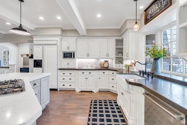 575 S 1560 E, Mapleton, UT 84664 - kitchen with built in appliances, a sink, ornamental molding, backsplash, and white cabinets