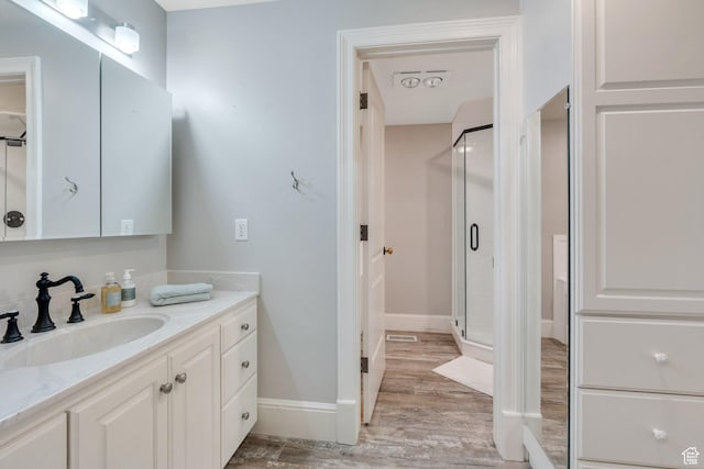 575 S 1560 E, Mapleton, UT 84664 - bathroom with wood finished floors, a shower stall, vanity, and baseboards
