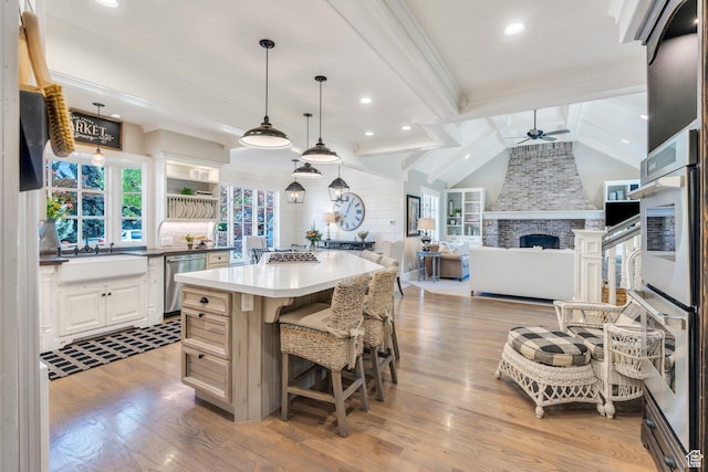 575 S 1560 E, Mapleton, UT 84664 - kitchen featuring ceiling fan, a sink, appliances with stainless steel finishes, wood finished floors, and a kitchen island