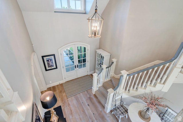575 S 1560 E, Mapleton, UT 84664 - entrance foyer featuring french doors, healthy amount of natural light, a high ceiling, stairway, and a chandelier