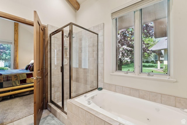 ensuite bathroom featuring a shower stall, a tub with jets, and tile patterned flooring