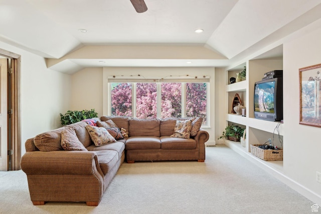 carpeted living area featuring lofted ceiling, built in features, a ceiling fan, recessed lighting, and baseboards