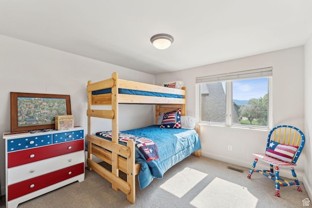 bedroom featuring carpet flooring and baseboards