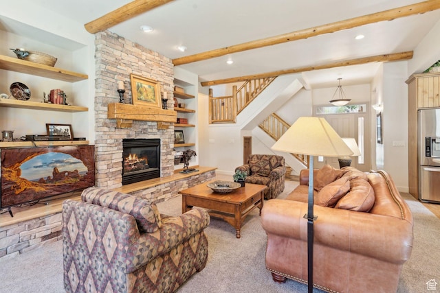 carpeted living area featuring beam ceiling, stairs, recessed lighting, a stone fireplace, and baseboards