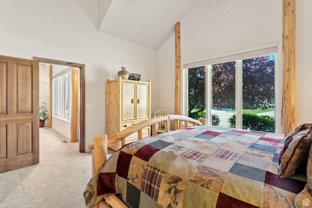 bedroom featuring light carpet and high vaulted ceiling