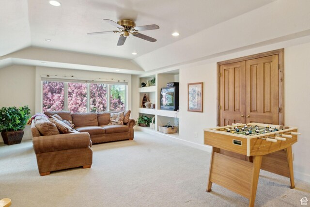 living area with carpet floors, recessed lighting, lofted ceiling, built in features, and a ceiling fan