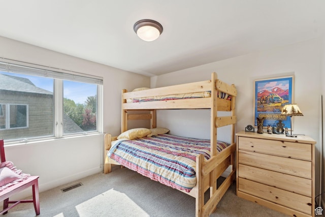 bedroom featuring carpet flooring and baseboards
