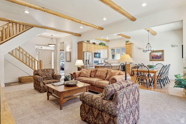 living area with beam ceiling, stairway, recessed lighting, a chandelier, and light colored carpet