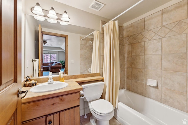 ensuite bathroom featuring toilet, vanity, and shower / bath combination with curtain