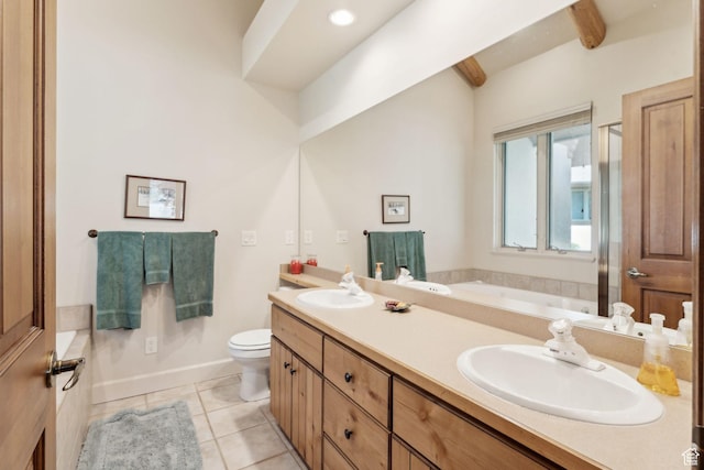 bathroom featuring a bath, tile patterned flooring, toilet, and double vanity