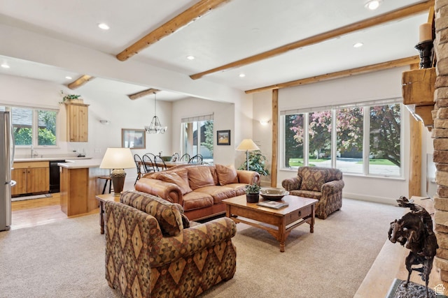 living room featuring light colored carpet, recessed lighting, beamed ceiling, and a chandelier