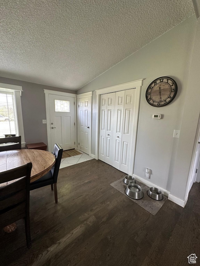 250 W 100 S, Duchesne, UT 84021 - foyer entrance with a textured ceiling, wood finished floors, vaulted ceiling, and baseboards