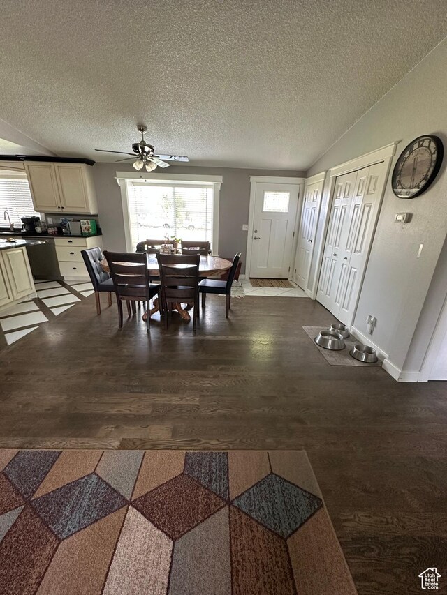 250 W 100 S, Duchesne, UT 84021 - dining room with a ceiling fan, dark wood-style flooring, a textured ceiling, lofted ceiling, and baseboards