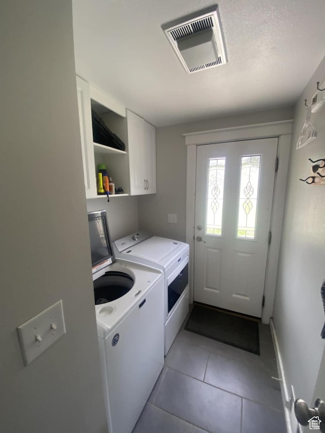 250 W 100 S, Duchesne, UT 84021 - washroom with washer and dryer, cabinet space, light tile patterned floors, and baseboards
