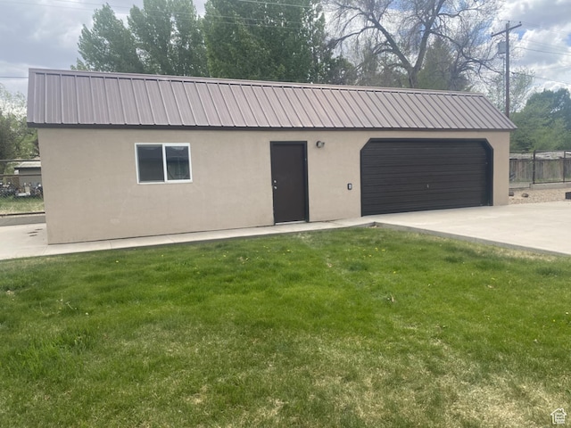 250 W 100 S, Duchesne, UT 84021 - view of front facade featuring stucco siding, metal roof, concrete driveway, and an attached garage