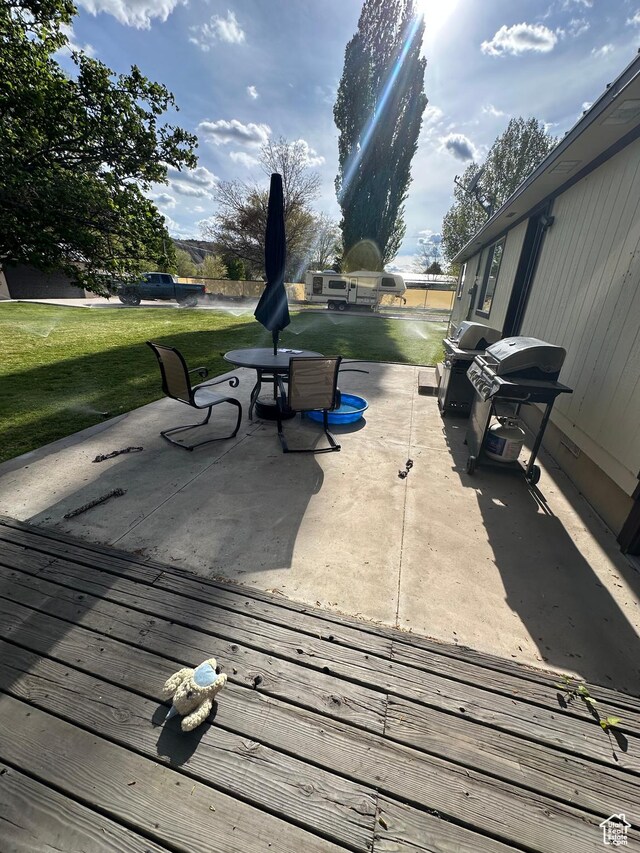 250 W 100 S, Duchesne, UT 84021 - wooden deck with a patio area, a yard, and area for grilling