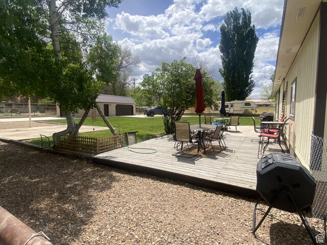 250 W 100 S, Duchesne, UT 84021 - wooden terrace featuring outdoor dining space and a lawn