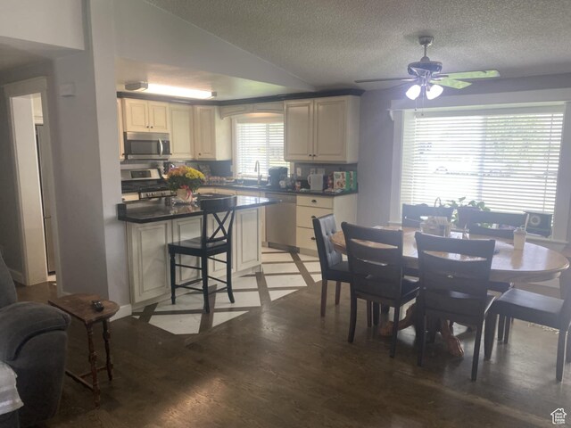250 W 100 S, Duchesne, UT 84021 - dining room with light wood-type flooring, a textured ceiling, and a ceiling fan