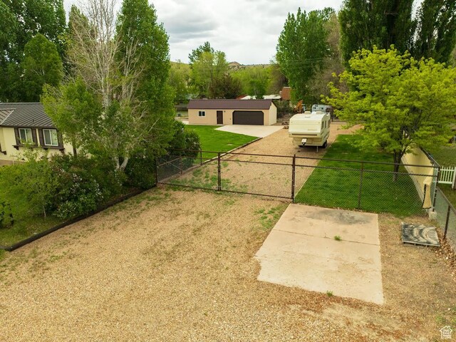 250 W 100 S, Duchesne, UT 84021 - view of yard featuring a gate, driveway, and a garage